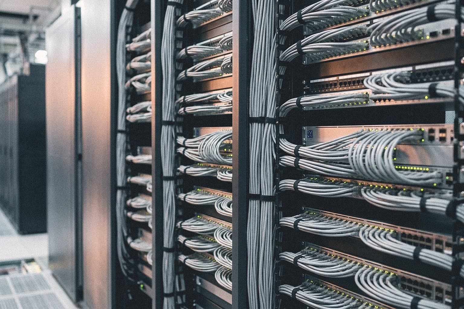 Open network rack with switches and neatly combed cables